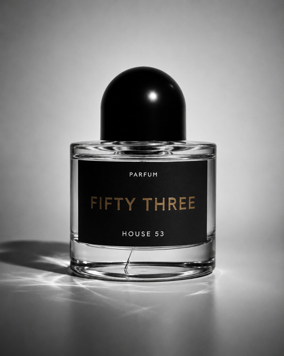 Fifty Three parfum bottle by House 53 photographed against a soft studio backdrop